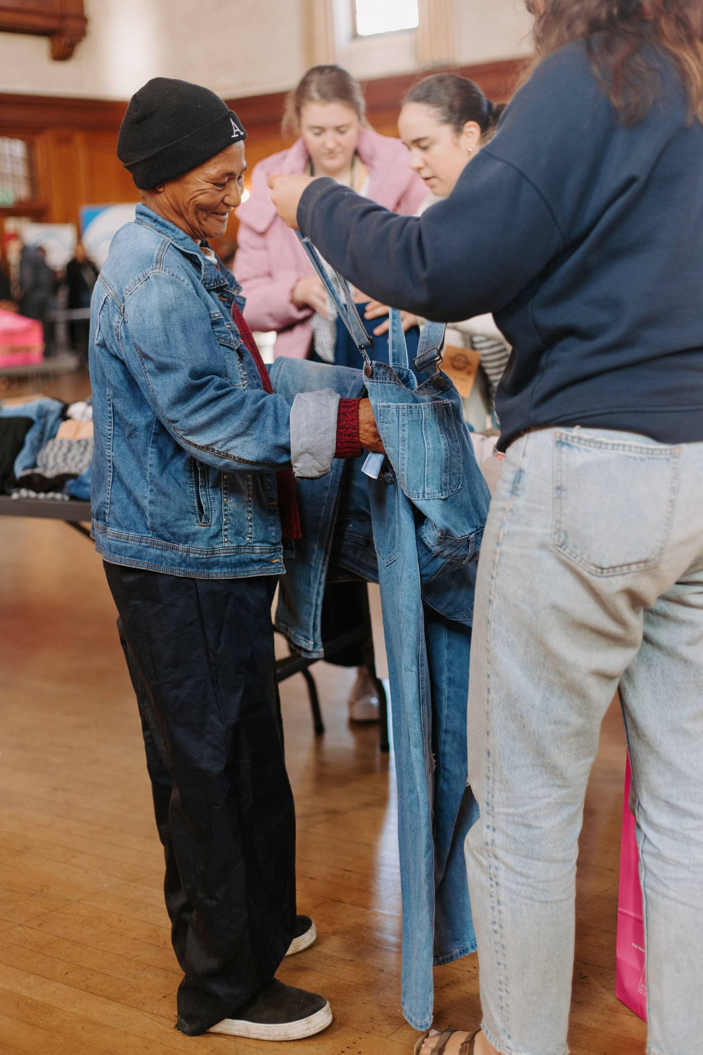 Community members receiving clothing and goods